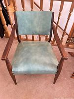Front view of teal vinyl accent chair