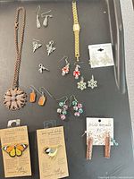 All jewelry items laid out on tray