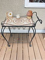 Full view of serving cart with accessories on top and lower shelf visible