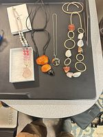 All four necklaces laid out together for overview