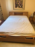 Full view of assembled bed showing mattress on frame