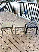 All three plastic patio side tables on deck