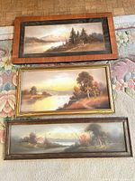 Three framed Chandler landscape prints laid out—overview of lot