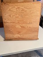 Front view of plywood tabletop easel with canvas ledge