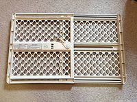 Full view folded adjustable white plastic gate