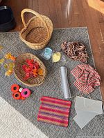 Lot overview showing baskets, foliage, fabrics, mesh, yarn, ribbons, signs