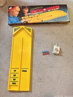 Full lot showing board, box, pucks, manual