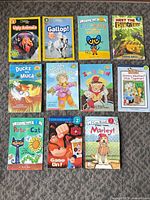 All 11 paperback children’s books displayed front covers visible