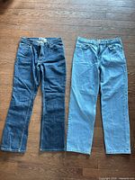 Front view of both jeans laid flat