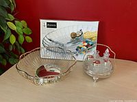 Overview of all three items: boxed relish dish, metal wire bowl, glass condiment set
