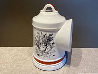 Front and side view showing botanical motif and banding