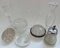 All eight clear glass items grouped