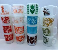 Front view of three stacks showing all 17 mugs and their patterns