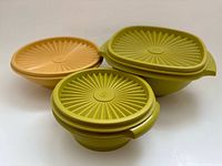 Three bowls with lids showing colors and shapes