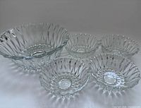 Full set showing large bowl and four small bowls