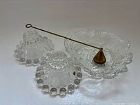 Full set showing two Boopie candle holders, Loganberry bowl, and brass snuffer