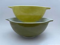 Both Pyrex Verde green Cinderella bowls stacked side view
