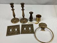 All eight brass items grouped