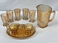 Full set displayed: pitcher, five tumblers, creamer, sugar bowl, tray