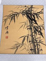 Full view of bamboo ink painting on gold background