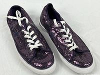 Top view of both Converse One Star purple sequin sneakers