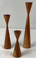 all three wood candlestick holders front view
