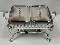 Front view of complete twin chafing dish set on stand