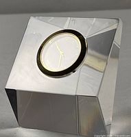 Front angled view of crystal cube clock showing overall form