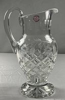 Full view of clear lead crystal pitcher showing shape and patterns