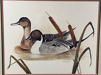 Close-up of print showing two Northern Pintail ducks and cattails