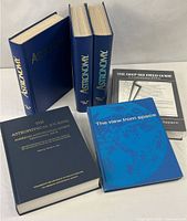 Group shot of all six astronomy books and bound magazine volumes