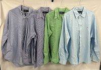 All four shirts hung side by side