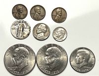 Full set of nine coins laid out for overview