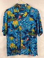 Front view of blue tropical print Hawaiian shirt