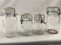 Group shot of four wire-bail canning jars