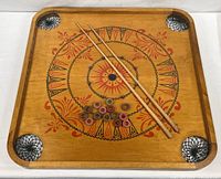 Full view of Carrom board with cues and rings