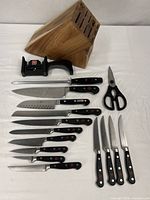 Full set laid out showing block, sharpener, honing steel, shears and knives