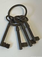 four cast iron skeleton keys on ring