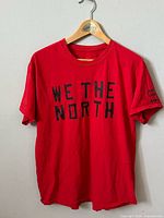 Front view showing "WE THE NORTH" graphic and sleeve text