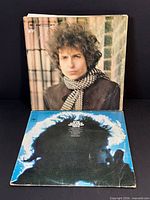 Front covers of Blonde On Blonde and Greatest Hits albums