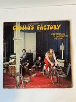 Front cover Cosmo's Factory LP with title and band image