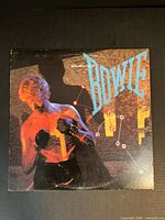 Front album cover with title and artist