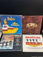 Overview of four Beatles LPs: Yellow Submarine, Love Songs, Something New, Help!