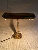 Full view of brass banker's lamp showing shade, column, base and cord