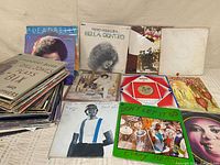 Spread of several album covers including Leadbelly, Bella Dentro, Beatles White Album, Disco compilation