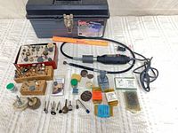 Full lot showing rotary tool, toolbox, accessories spread out