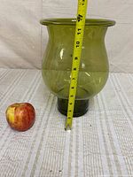 Side view with tape showing ~12 in height and apple for scale