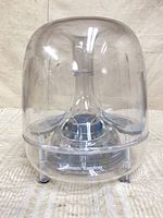 Front view of clear dome subwoofer with Harman Kardon logo