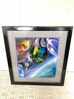 Front view of framed painting showing entire cosmic scene and frame