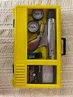 Full view of yellow Equus carry case with timing light, analyzer, gauges and adapter